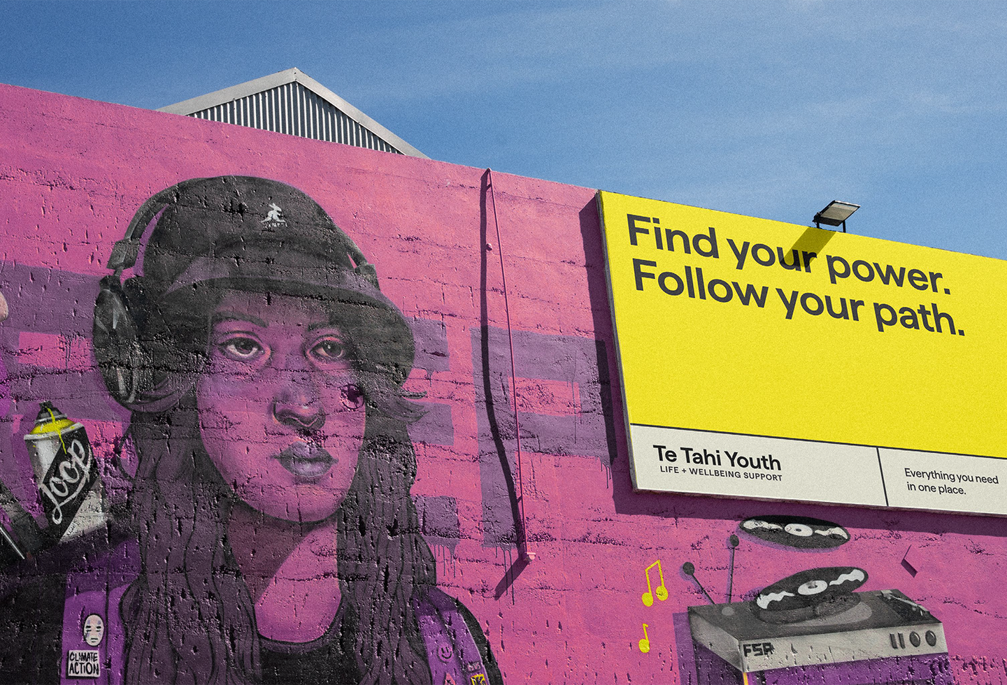 Te Tahi Youth branded billboard on a graffiti murial