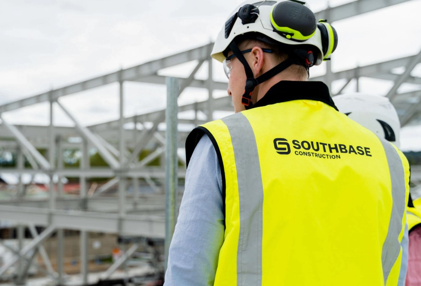 Person in Southbase Construction high vis on site