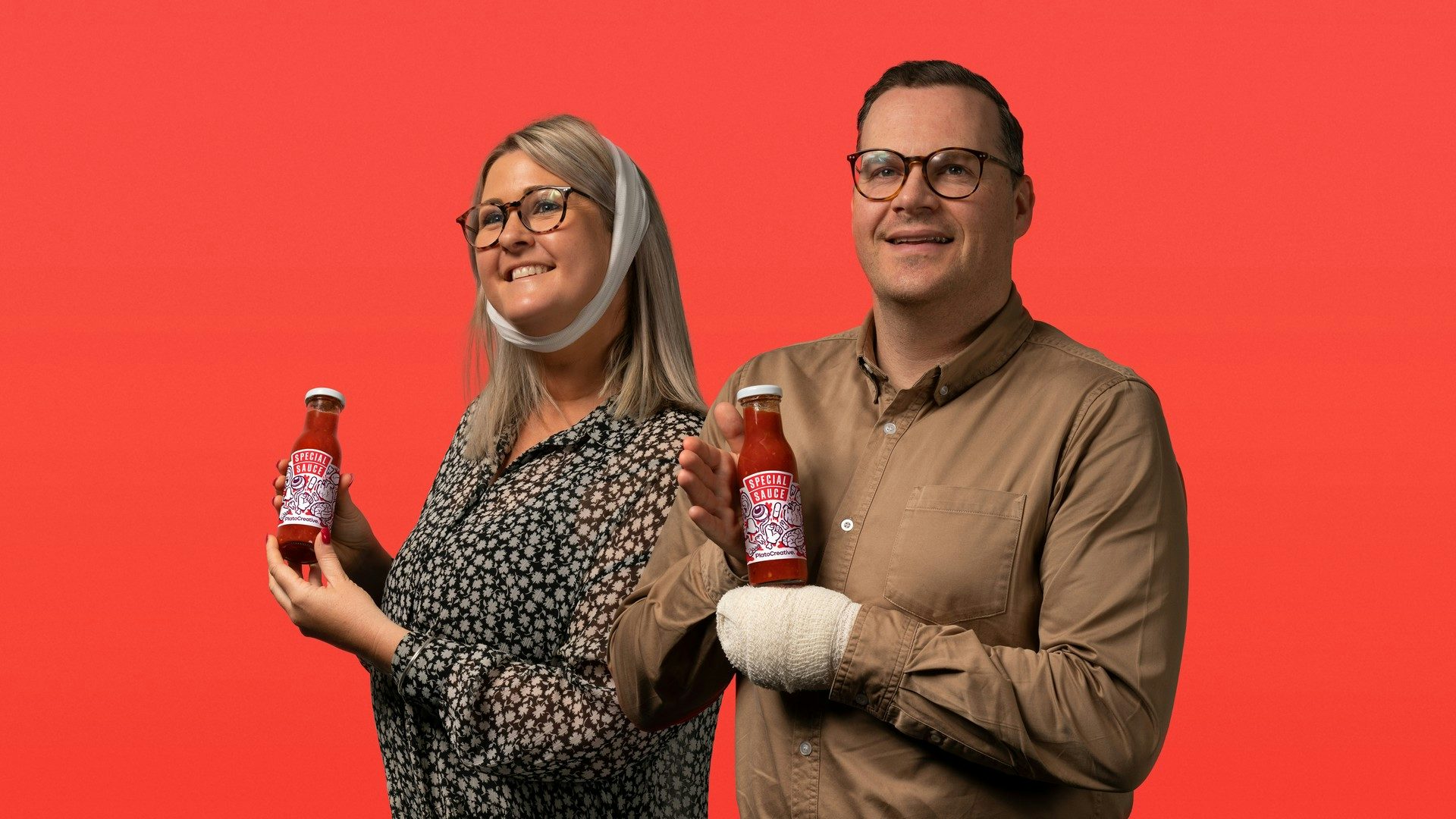 People from Plato showcasing the Special Sauce bottles